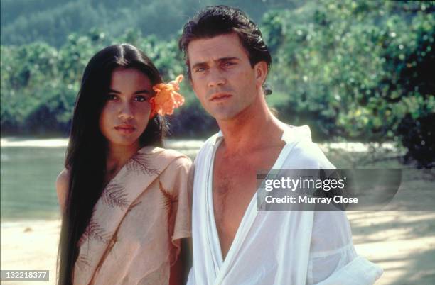 Actor Mel Gibson as mutineer Fletcher Christian and Tevaite Vernette as Mauatua in the film 'The Bounty', 1984.