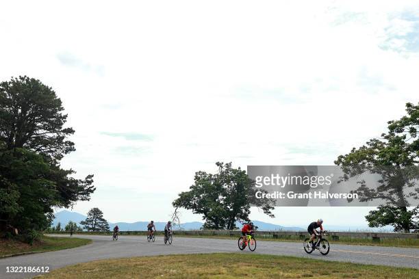 Athletes make their way across the Blue Ridge Parkway during the cycling portion of the IRONMAN 70.3 Virginia's Blue Ridge on June 06, 2021 in...