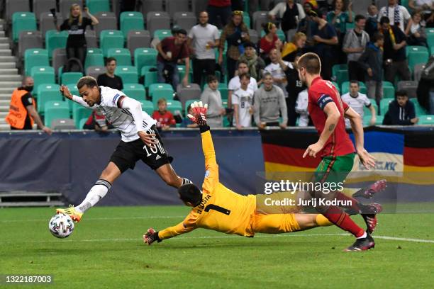 Lukas Nmecha of Germany scores their side's first goal past Diogo Costa of Portugal during the 2021 UEFA European Under-21 Championship Final match...