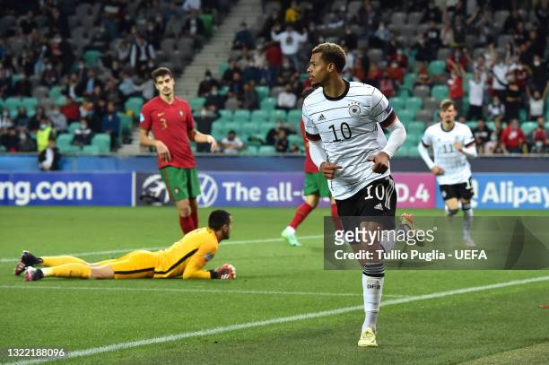Lukas Nmecha of Germany celebrates after scoring their side's first goal during the 2021 UEFA European Under-21 Championship Final match between...
