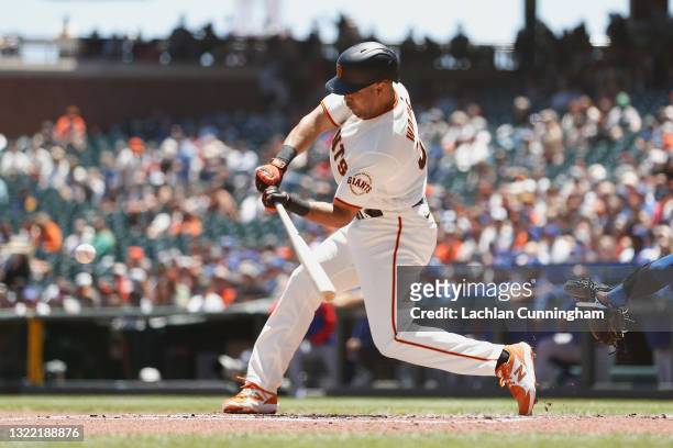 LaMonte Wade Jr of the San Francisco Giants hits a solo home run in the bottom of the first inning against the Chicago Cubs at Oracle Park on June...