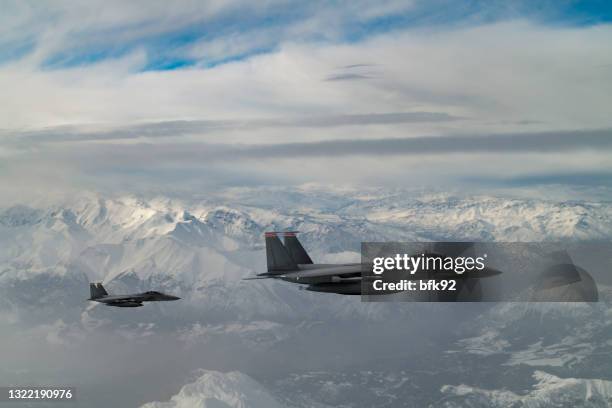 jet fighters flying over the clouds. - air force operations stock pictures, royalty-free photos & images