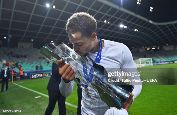 Lukas Nmecha of Germany kisses the UEFA European Under-21 Championship trophy following victory in the 2021 UEFA European Under-21 Championship Final...