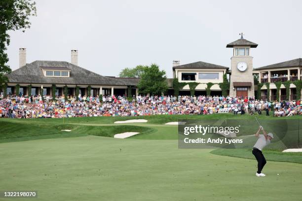 Scottie Scheffler of the United States plays a shot on the 18th hole during the final round of The Memorial Tournament at Muirfield Village Golf Club...