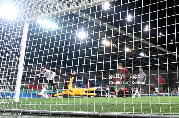 Lukas Nmecha of Germany scores their side's first goal past Diogo Costa of Portugal during the 2021 UEFA European Under-21 Championship Final match...