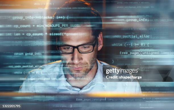 digitally enhanced shot of a handsome businessman working in the office superimposed over multiple lines of computer code - javascript stock pictures, royalty-free photos & images