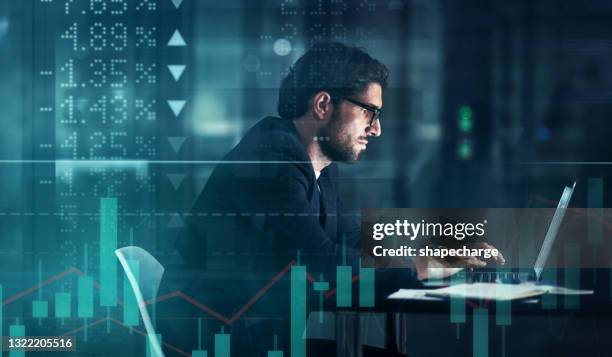 digitally enhanced shot of a handsome businessman using a laptop superimposed over a graph showing the ups and downs of the stock market - table numbers stock pictures, royalty-free photos & images