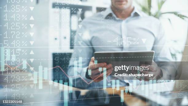 digitally enhanced shot of an unrecognizable businessman using a tablet superimposed over a graph showing the ups and downs of the stock market - man double exposure profit concept stock pictures, royalty-free photos & images