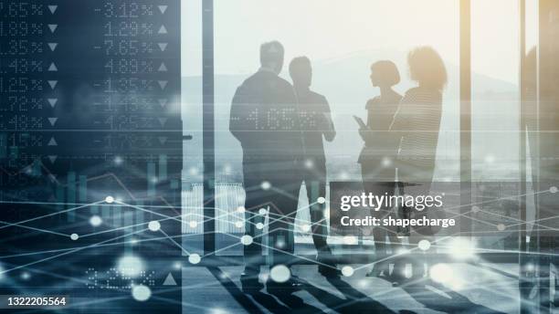 digitally enhanced shot of a group of businesspeople meeting in the boardroom superimposed over a graph showing the ups and downs of the stock market - man double exposure profit concept stock pictures, royalty-free photos & images