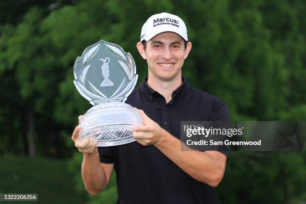 Patrick Cantlay of the United States poses with the trophy after winning The Memorial Tournament in the first playoff hole at Muirfield Village Golf...
