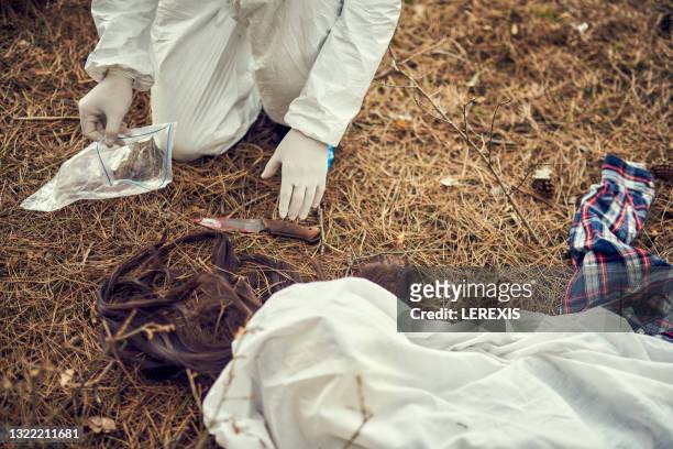 taking a knife knife crime scene - killing stock pictures, royalty-free photos & images