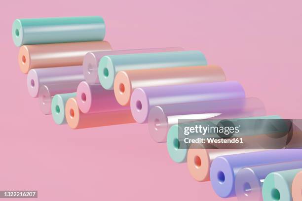 stockillustraties, clipart, cartoons en iconen met three dimensional render of row of pastel colored cylinders floating against pink background - tube