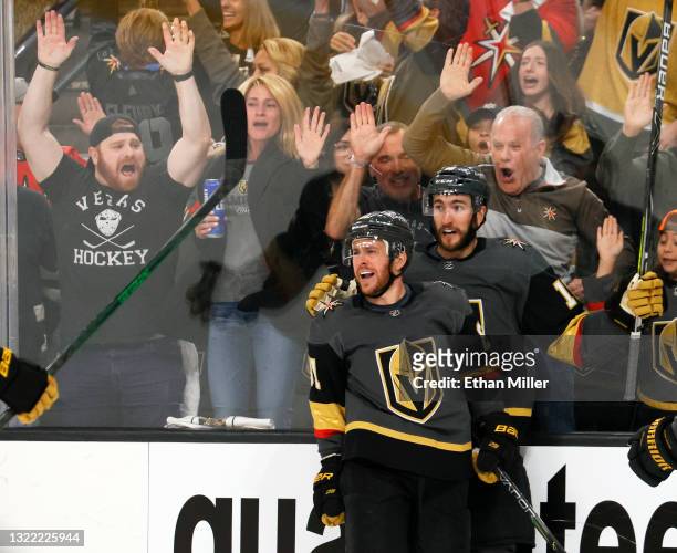 Jonathan Marchessault and Nicolas Roy of the Vegas Golden Knights celebrate Marchessault's second-period power-play goal against the Colorado...