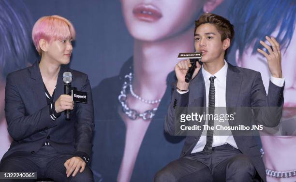 Baekhyun and Lucas of SuperM attend the press conference at Dragon City Hotel on October 02, 2019 in Seoul, South Korea.