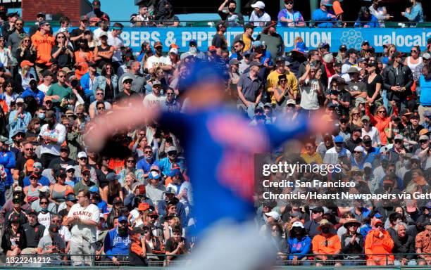 The bleachers are full in vaccinated sections as Craig Kimbrel pitches in the ninth inning as the San Francsico Giants played the Chicago Cubs at...