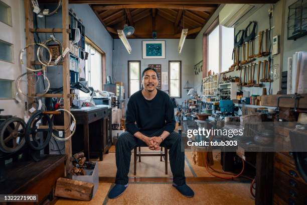 portrait of a japanese jeweler and silversmith in his workshop - traditional craftsman stock pictures, royalty-free photos & images