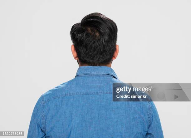 rear view of young man - denim shirt stock pictures, royalty-free photos & images
