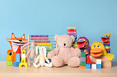 Collection of different toys on wooden table