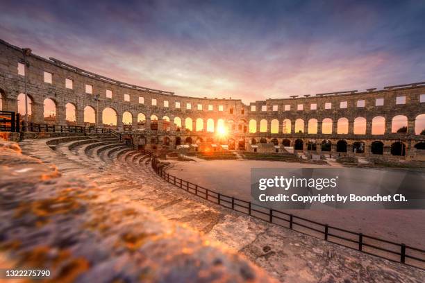 beautiful sunset at pula arena, croatia - pula stock-fotos und bilder