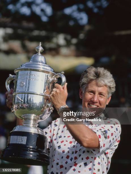 Patty Sheehan of the United States holds the champion golfer trophy after winning the 49th United States Women's Open Championship golf tournament on...