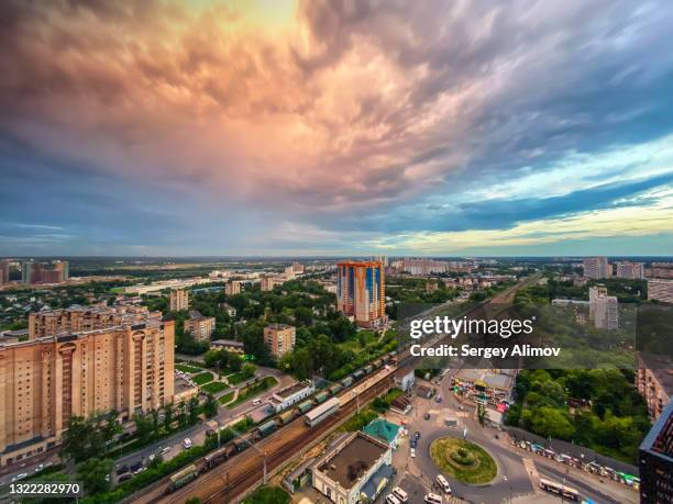 dramatic cloudscape above suburban city - krasnogorsky district moscow oblast stock pictures, royalty-free photos & images