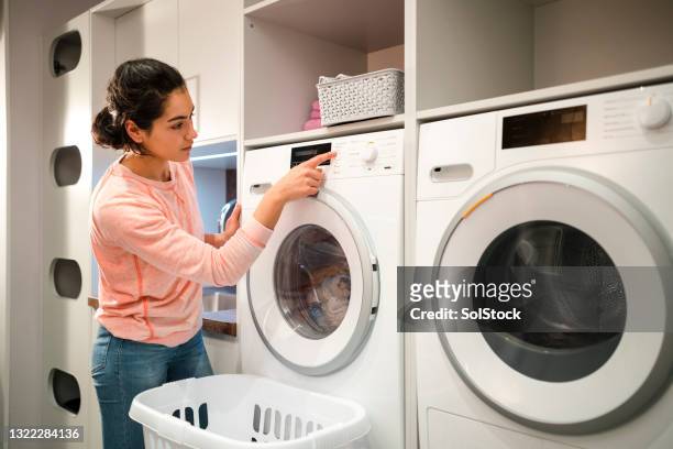 doing the laundry - kitchen appliance stock-fotos und bilder