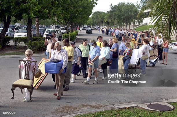 People hoping to appear on the Chubb''s Antiques Roadshow television show stand in line June 16, 2001 outside the Coconut Grove Convention Center in...