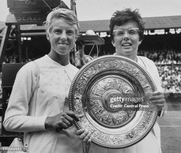 Ann Haydon-Jones of Great Britain and Billie Jean King of the United States pose for photographs holding the Venus Rosewater Dish after their Women's...