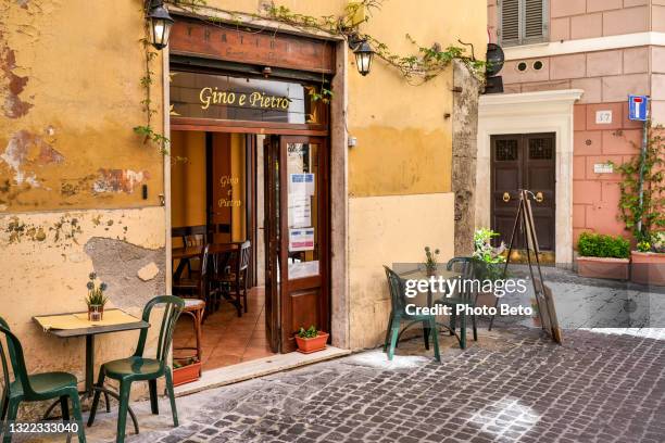a typical roman tavern along via del governo vecchio in the historic heart of rome near piazza navona - bar facade stock pictures, royalty-free photos & images