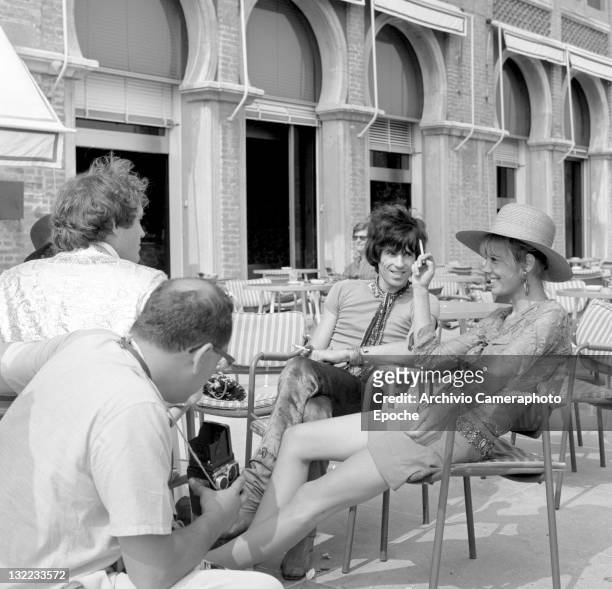 English musician Keith Richards and Anita Pallemberg during a shooting session outside the Excelsior Hotel, Lido, Venice, 1967.