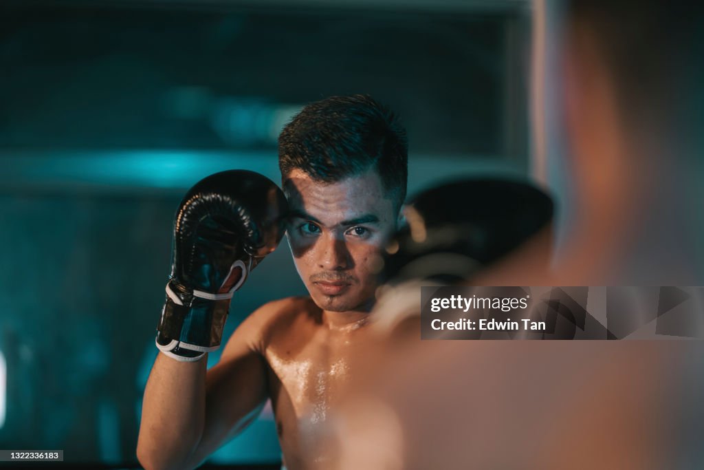 Muay Thai athletes training on the boxing ring match getting ready to fight