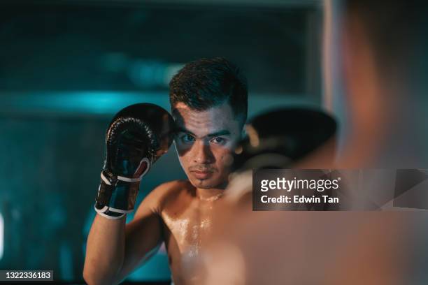 muay thai athletes training on the boxing ring match getting ready to fight - mixed martial arts stock pictures, royalty-free photos & images