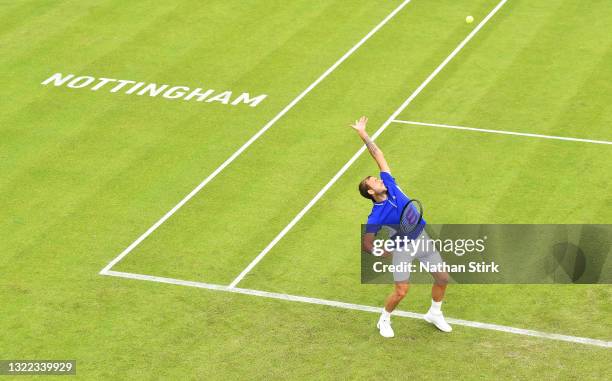 Daniel Evans of Great Britain serves against Thanasi Kokkinakis of Australia during Day 3 of the Viking Open at Nottingham Tennis Centre on June 07,...