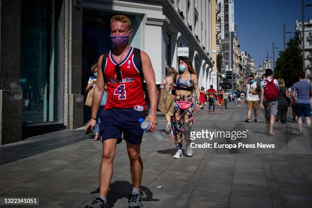 Man walks along Gran Via, on the first day that Spain allows the entry of travellers vaccinated against Covid-19 from third countries to the European...