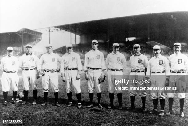 Portrait of nine members of the Detroit Tigers baseball team as they pose on the field at Bennett Park, Detroit, Michigan, 1910. Among those pictured...