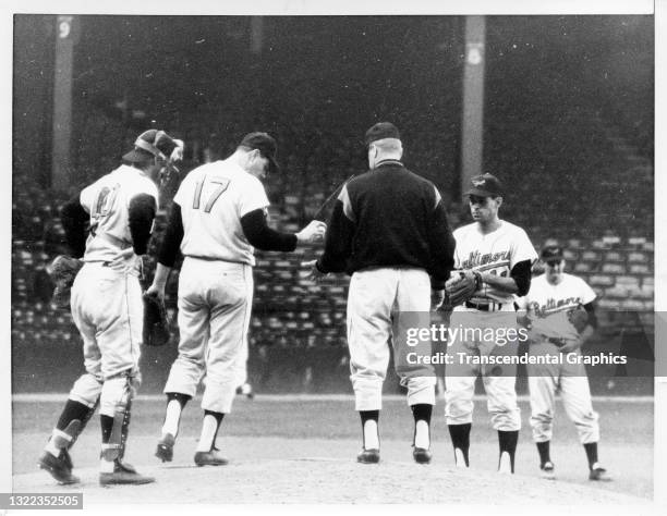 American baseball manager Hank Bauer , of the Baltimore Orioles, takes the ball from an unidentified pitcher during at Memorial Stadium, Baltimore,...