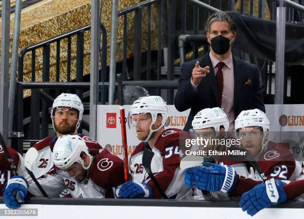 Head coach Jared Bednar of the Colorado Avalanche handles bench duties behind Kiefer Sherwood, Tyson Jost, Carl Soderberg, Nathan MacKinnon and...