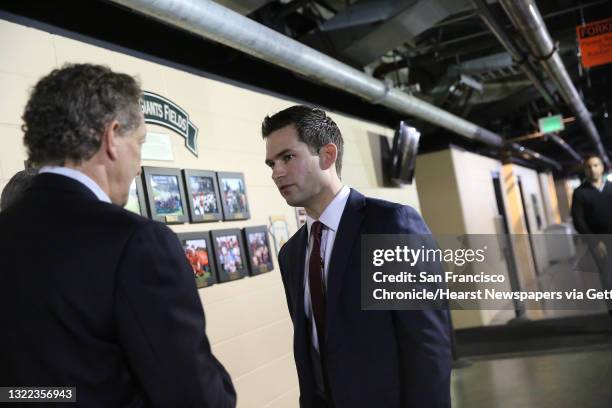 San Francisco Giants' new general manager Scott Harris talks with president and CEO Larry Baer after a press conference at Oracle Park on Monday,...