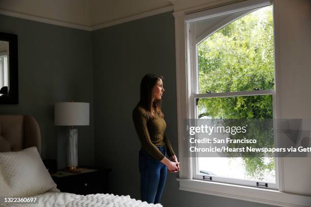 Nicole Steves stands for a portrait next to the window in her bedroom at her home on Wednesday, April 29, 2020 in San Francisco, CA. A man threw a...