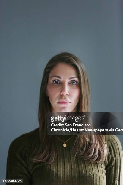 Nicole Steves stands for a portrait next to the window in her bedroom at her home on Wednesday, April 29, 2020 in San Francisco, CA. A man threw a...