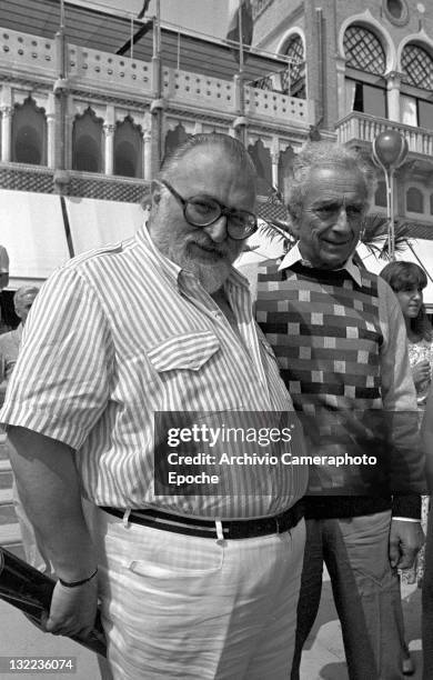 Italian director Sergio Leone with Michelangelo Antonioni outside the Excelsior hotel, Lido, Venice, 1984.