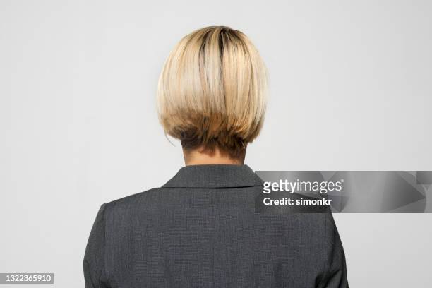 rear view of thoughtful businesswoman - bob imagens e fotografias de stock