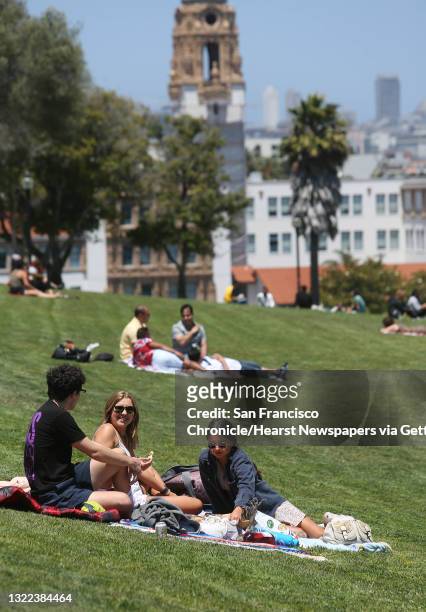 Drew McAlavey , Abbie Chomesom and Sarah Adams, all of San Jose, enjoy a picnic in Dolores Park on Wednesday, July 1, 2020 in San Francisco, Calif.
