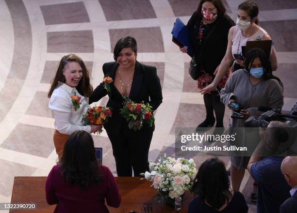 Madelyn Peterson and her partner Indira Carmona Muñoz react after there were married by San Francisco Mayor London Breed at San Francisco City Hill...