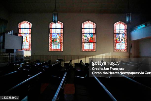 Pews below stained glass windows are seen at St. Paul’s Presbyterian Church on Thursday, January 23, 2020 in San Francisco, Calif.