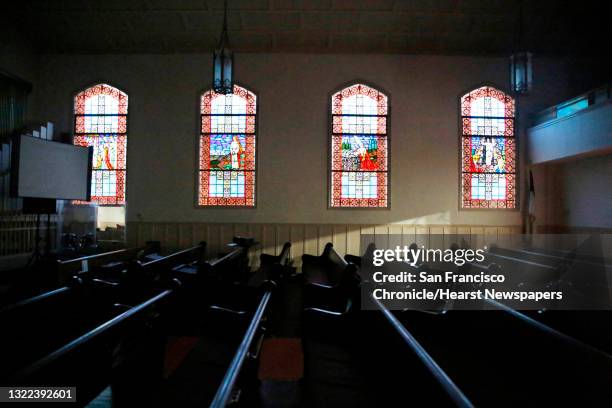 Pews below stained glass windows are seen at St. Paul’s Presbyterian Church on Thursday, January 23, 2020 in San Francisco, Calif.