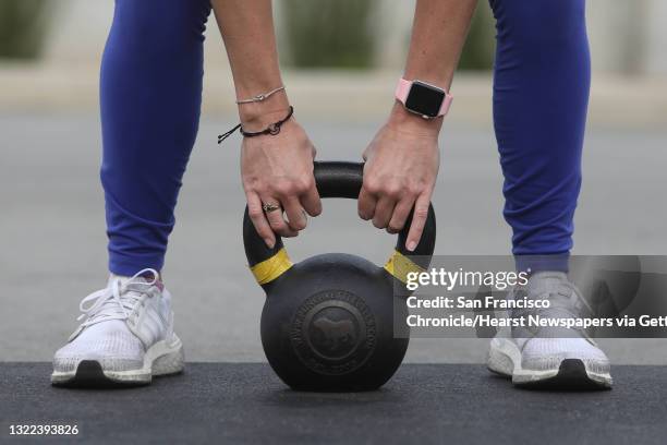 Shannon King of San Francisco uses a kettlebell during a SF CrossFit class with Yasmen Mehta , Crossfit coach, on Wednesday, November 11, 2020 in San...