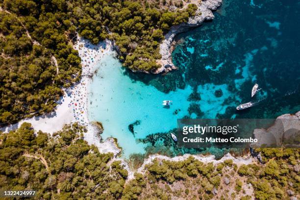 overhead view of cala turqueta beach, menorca - idyllic stock pictures, royalty-free photos & images