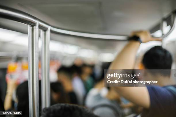 crowded carriage during rush hour on the beijing subway - beijing subway line stock pictures, royalty-free photos & images