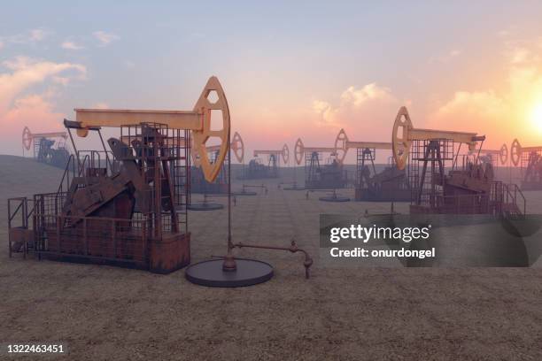 pozo de petróleo con plataformas de perforación y pumpjacks - oil field fotografías e imágenes de stock